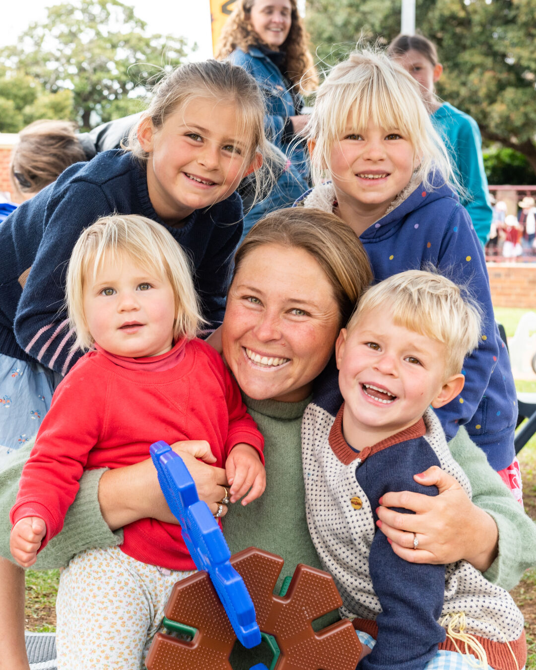 Smiling mum with four children