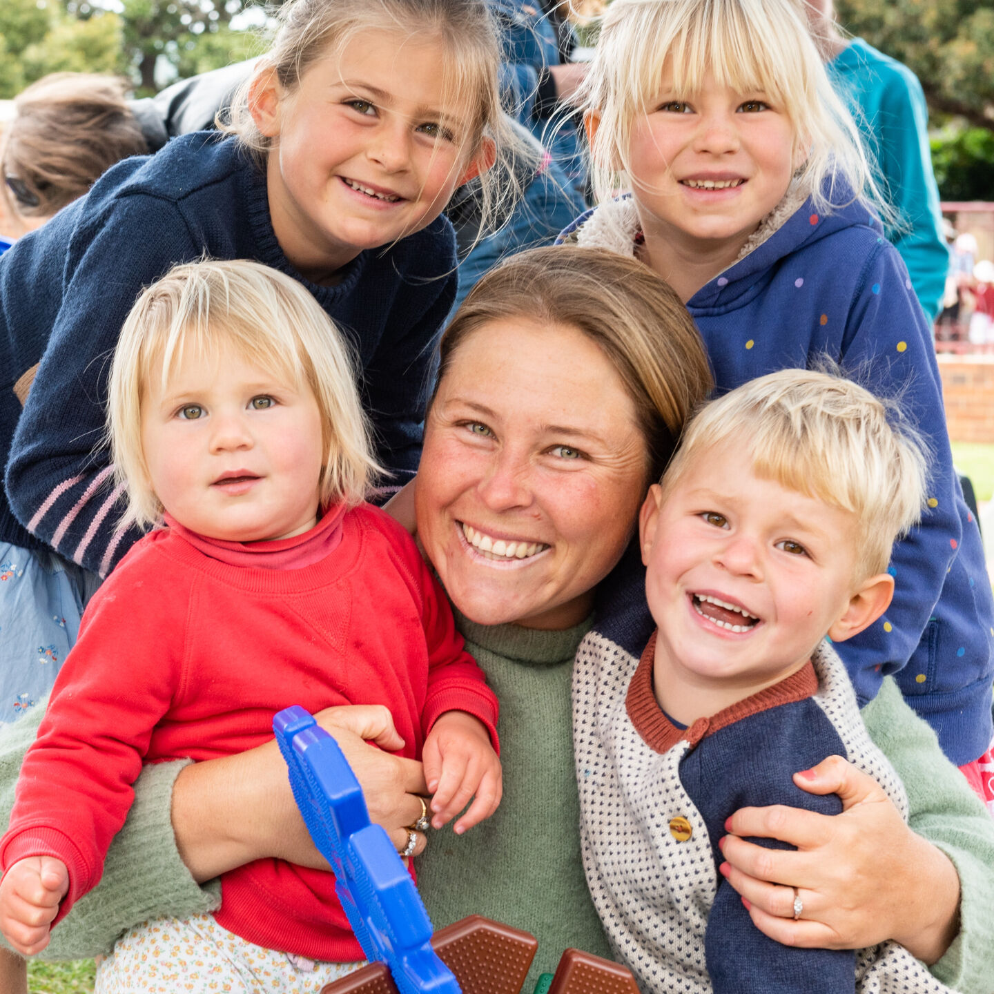 Smiling mum with four children