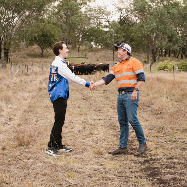Justin Tamblyn and mort & co representative shaking hands outdoors