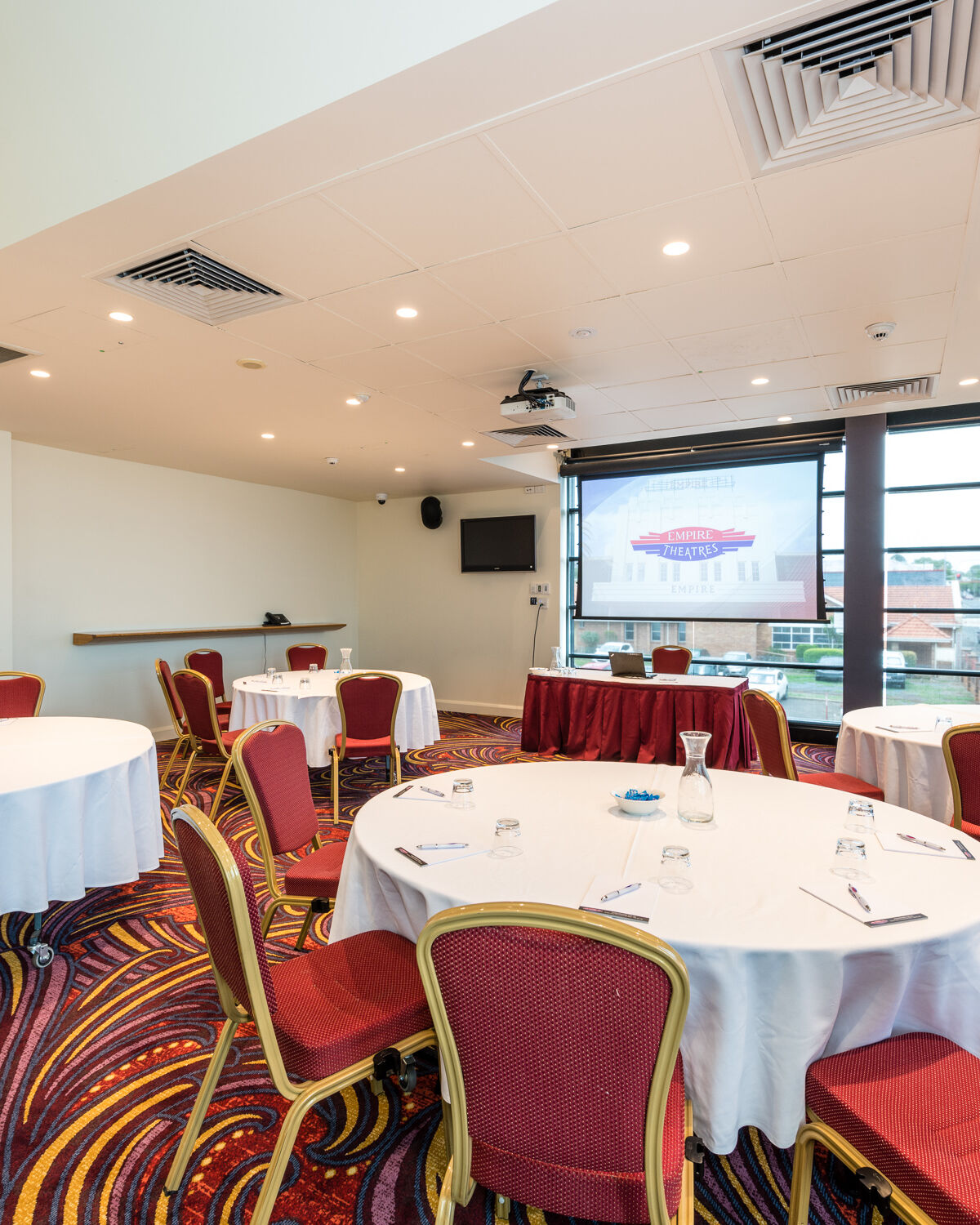 Supper Room with Tables and projector set up